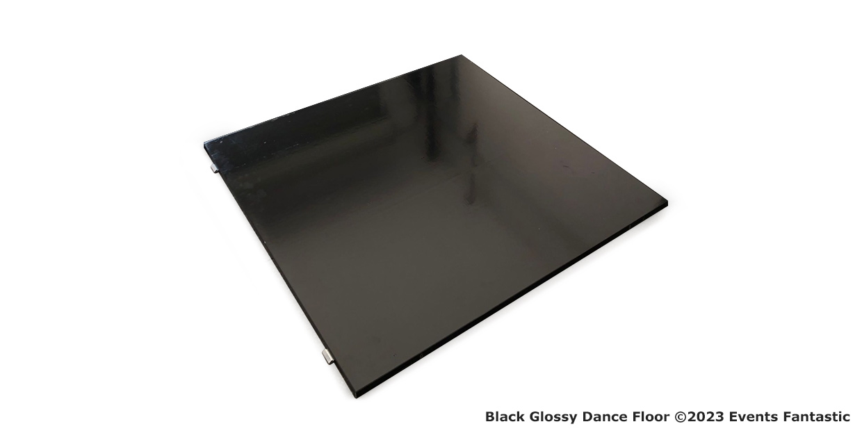 A large, shiny black dance floor panel isolated on a white background, with a watermark text stating "black glossy dance floor ©2023 events fantastic.